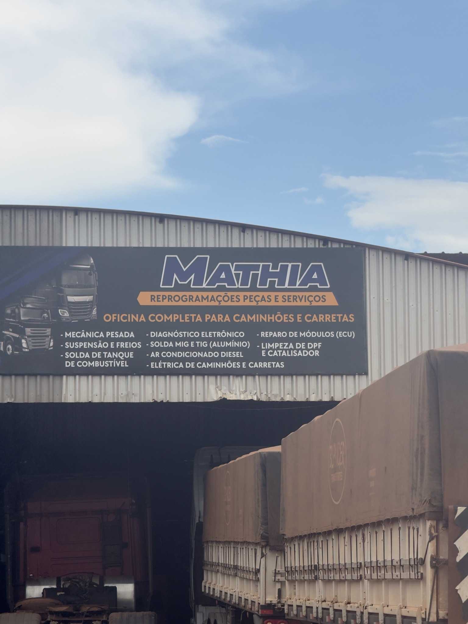 Placa da oficina Mathia: reprogramações, peças e serviços, oficina completa para caminhões e carretas